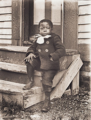 Portrait of Ralph Mendis on a Stoop, about 1902