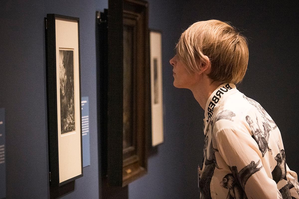A guest viewing works in the 'Rembrandt' exhibition
