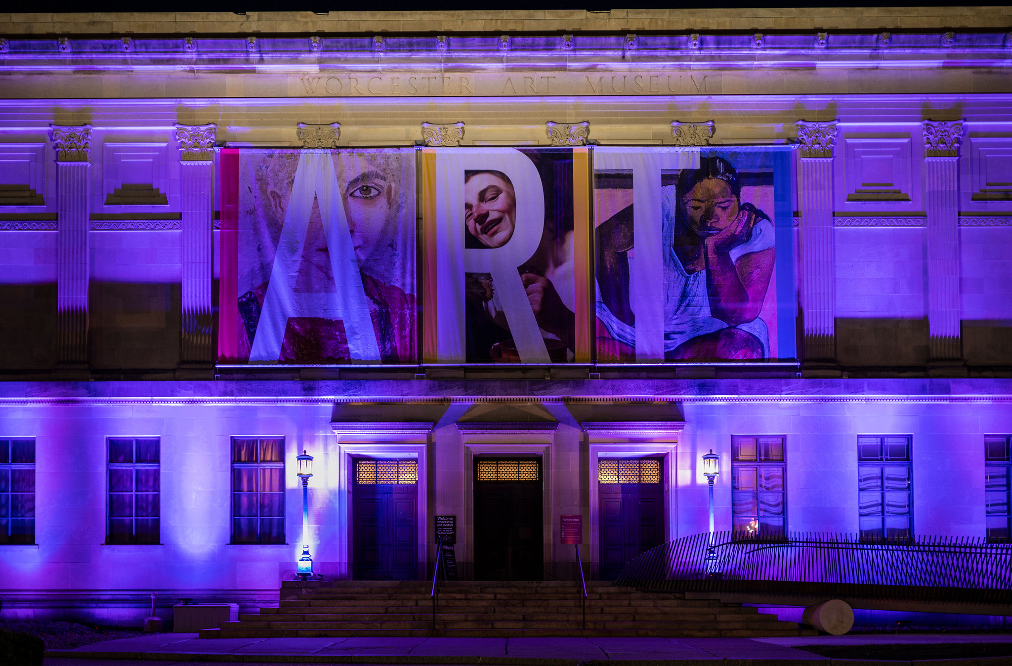 Nighttime view of Worcester Art Museum's illuminated façade.