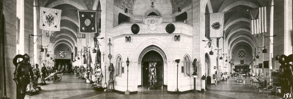 A view of the Great Hall at the Higgins Armory Museum, showing the many suits of armor on display