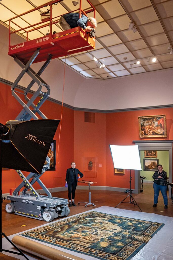 Photographing a tapestry from above on a scissor lift