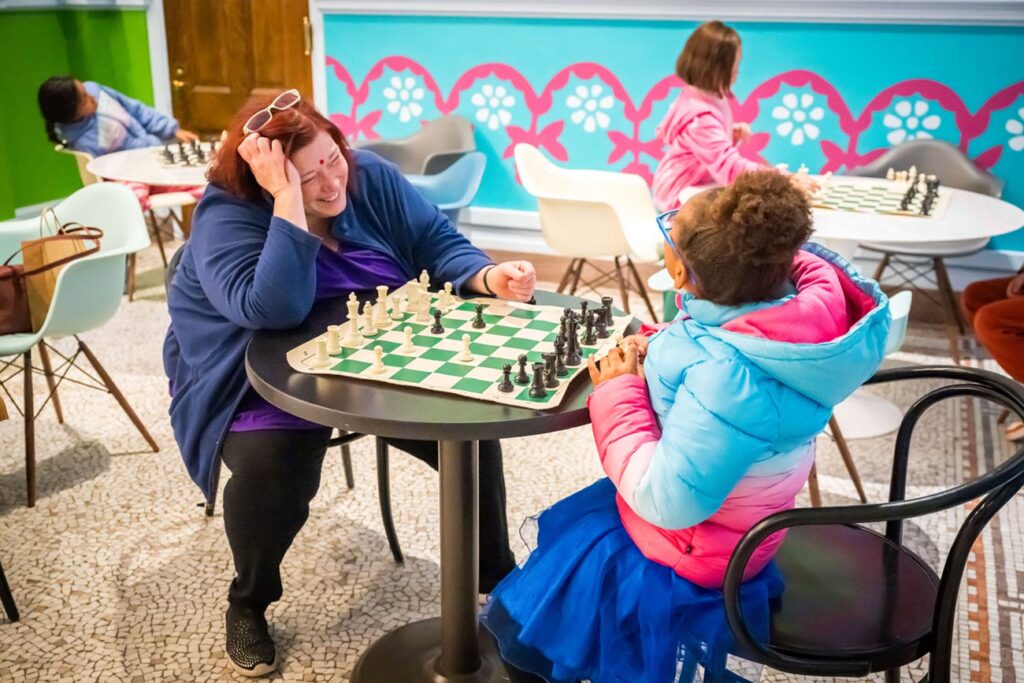 Visitors enjoying a game of chess in Salisbury Hall