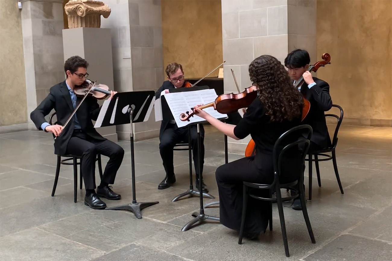 Joy of Music string quartet performing in Renaissance Court