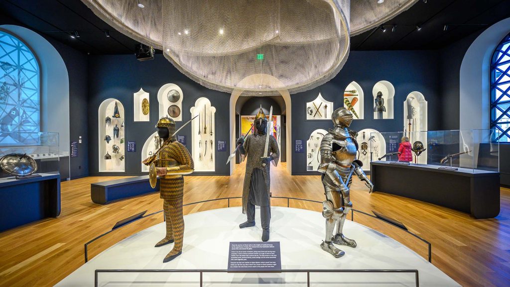 View of the Arms and Armor Galleries with suits of armor in the foreground