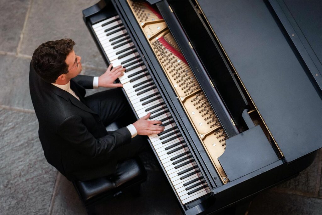 Overhead view of George Smith playing the piano