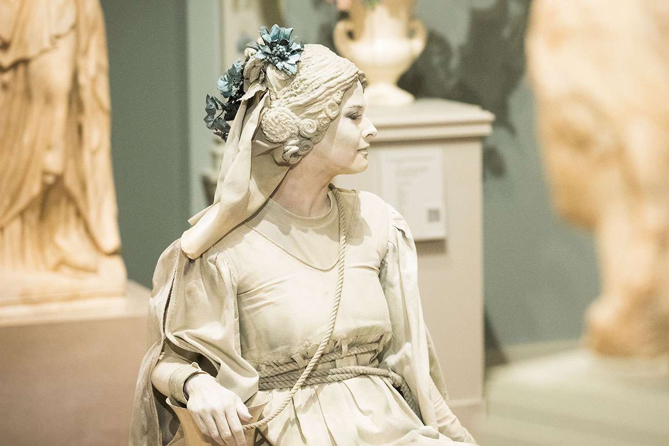 A 'Living Statue' performing in the Roman gallery