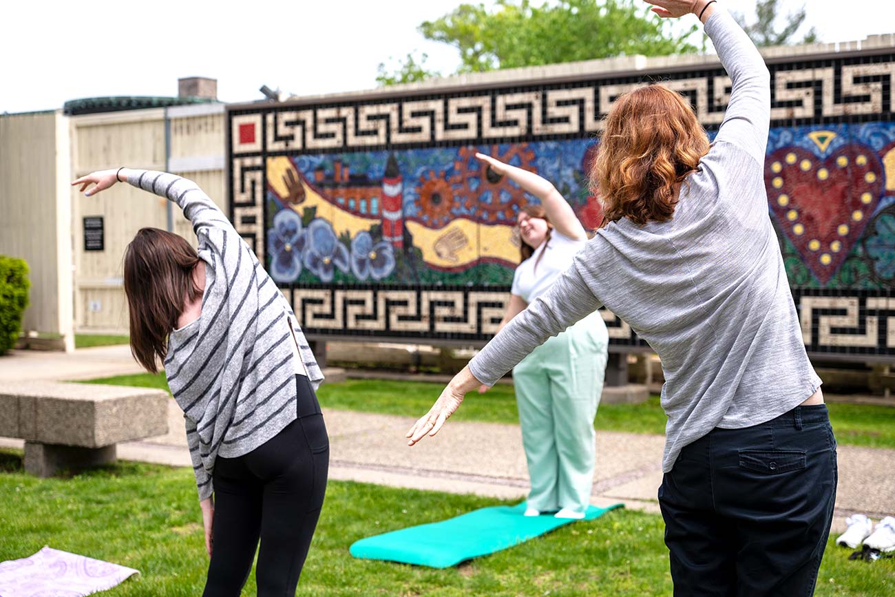 A yoga session in progress in WAM's Stoddard Courtyard