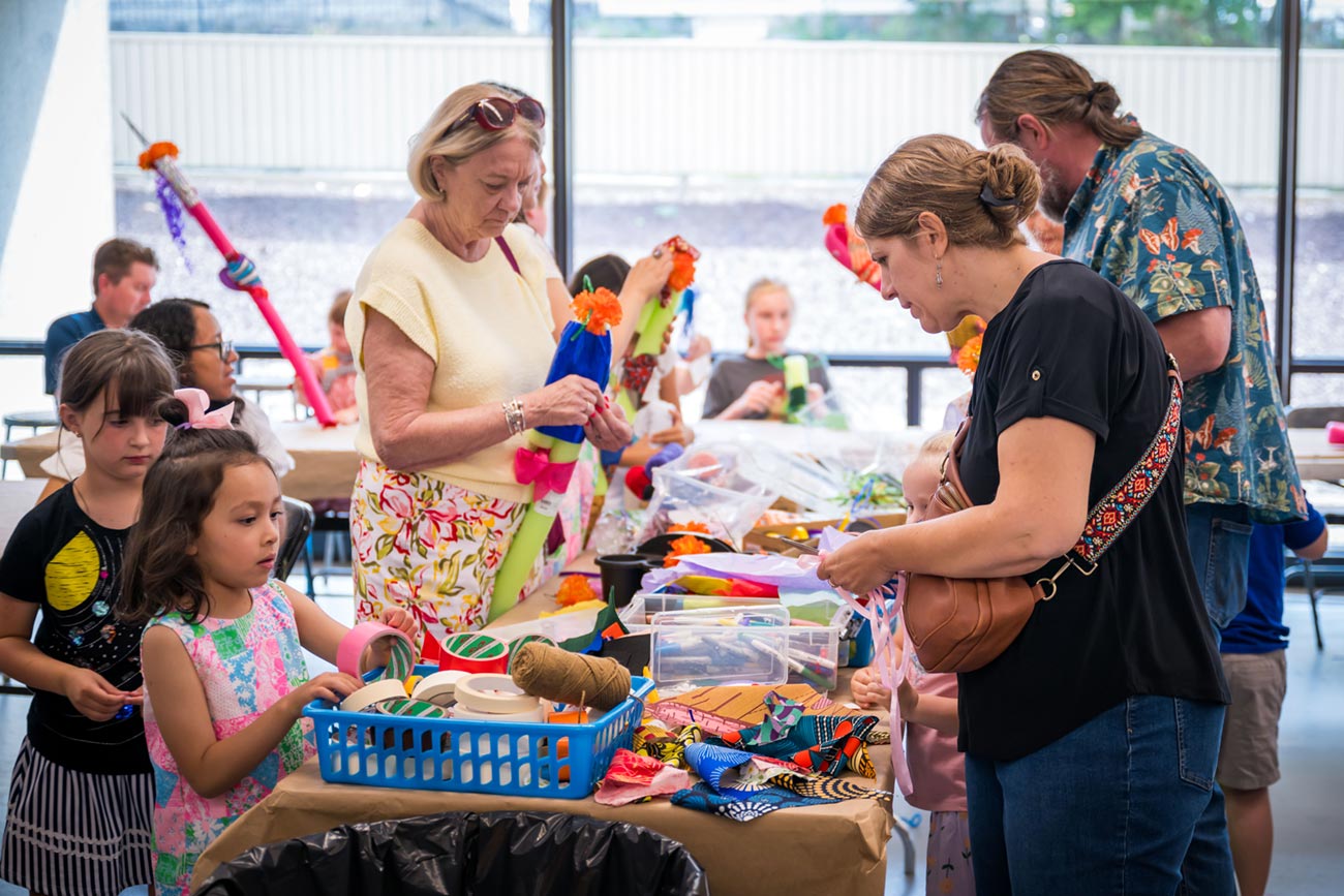 Youth and adults choose materials for their artmaking